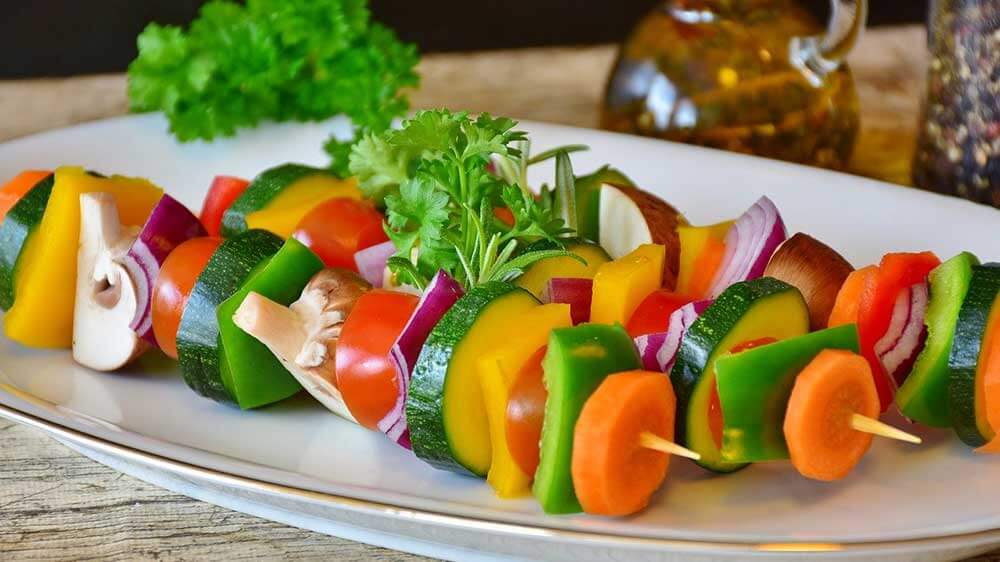 vegetable skewers on a plate