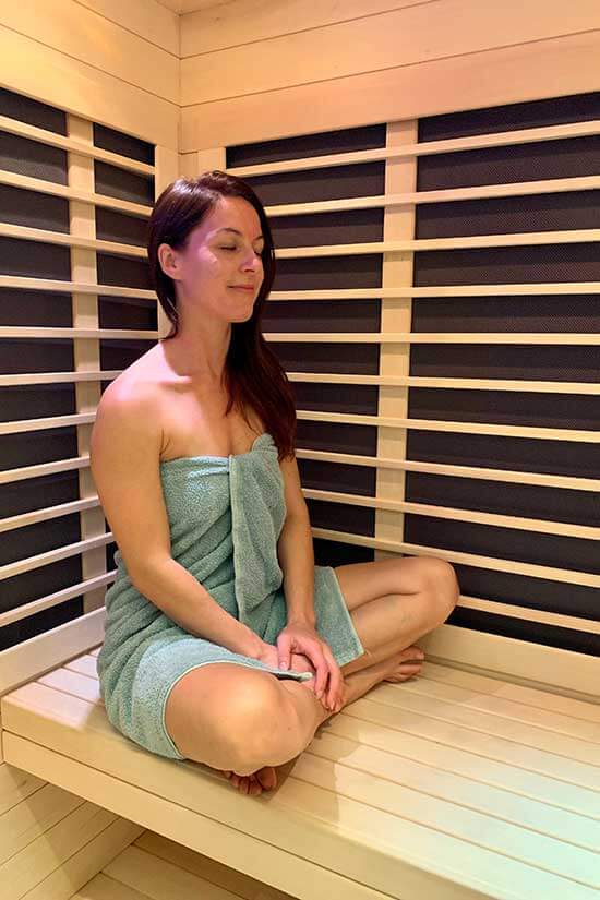 woman relaxing in sauna